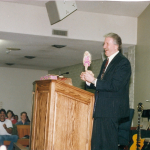 bob overson receives a barbie doll as a gift from the prescott cong, 1996